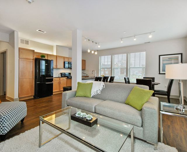 Orleans Landing - Plank Wood Flooring throughout Living Space